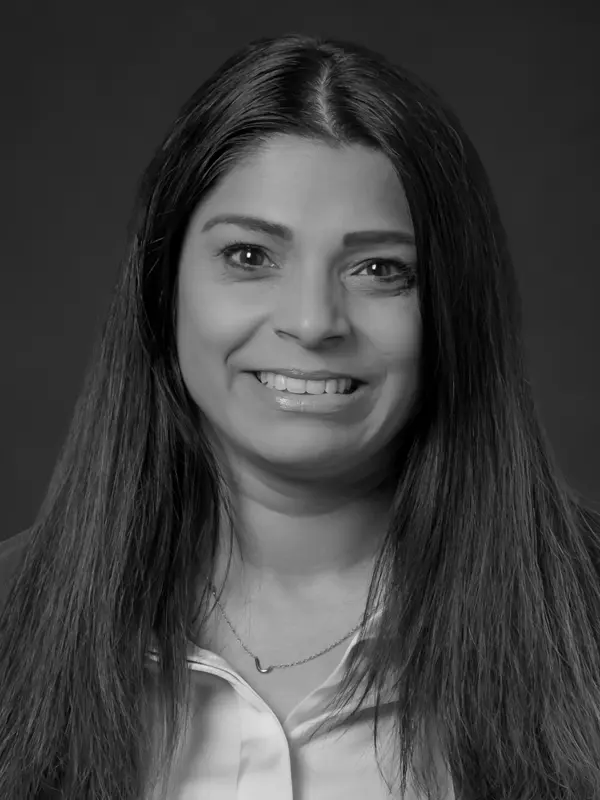 Professional headshot of Jackie Usguruge